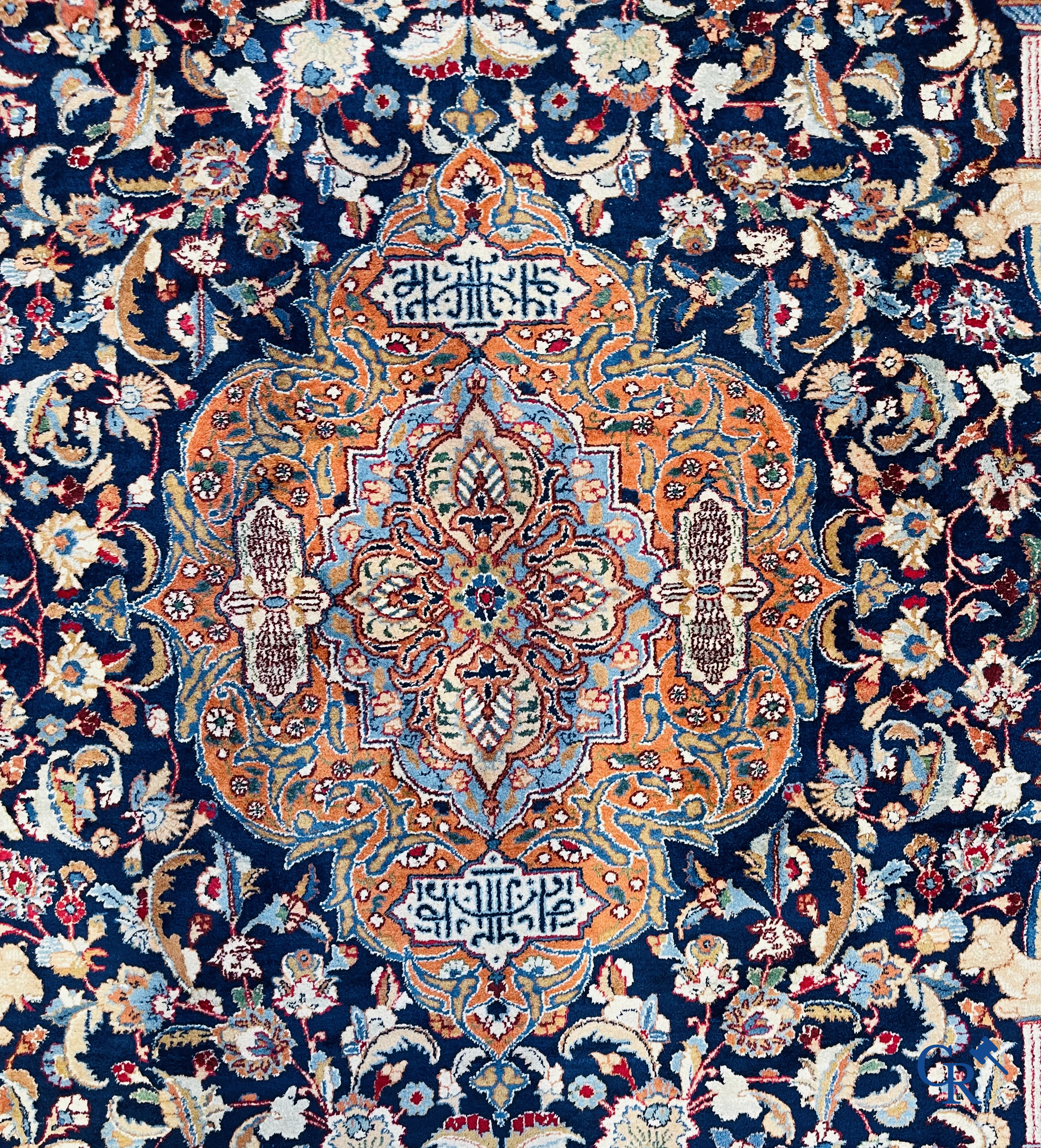 Oriental carpets: A large hand-knotted oriental carpet with antique decor. Multiple inscriptions.