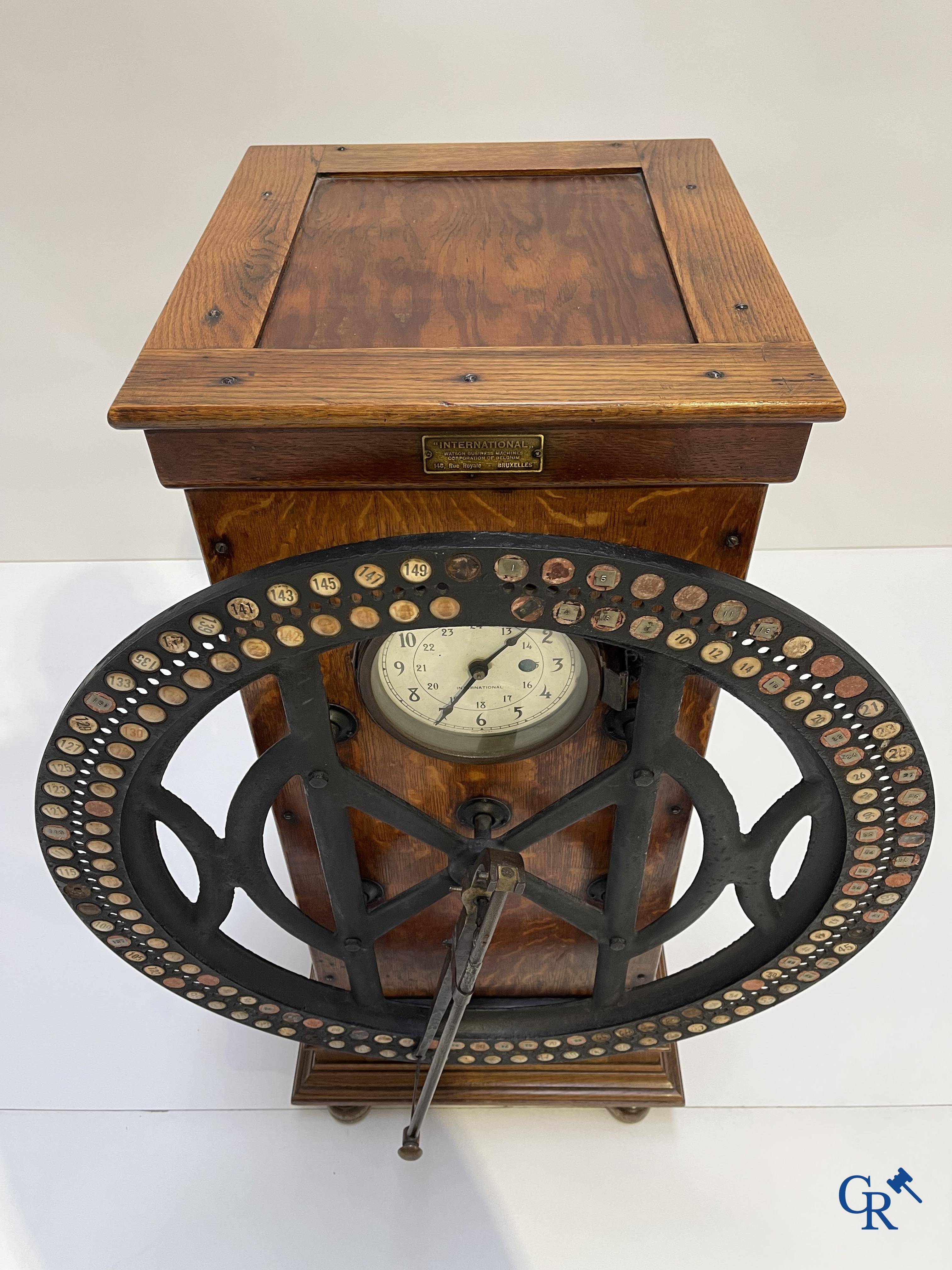 "International" Watson Business Machines Corporation of Belgium. A time clock with cast iron wheel. Circa 1900.