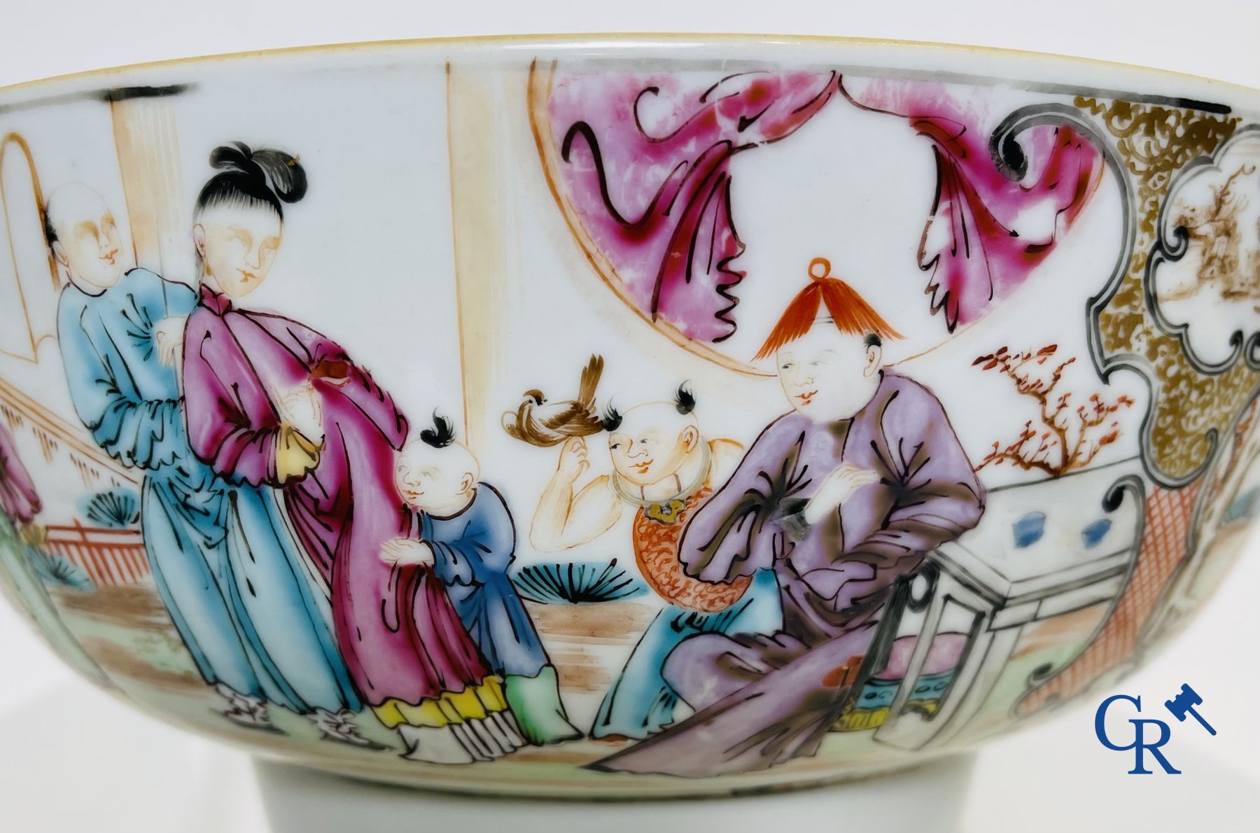 Un grand bol chinois decor mandarin en famille rose, une tasse et soucoupe en famille rose et une figurine en blanc de chine.