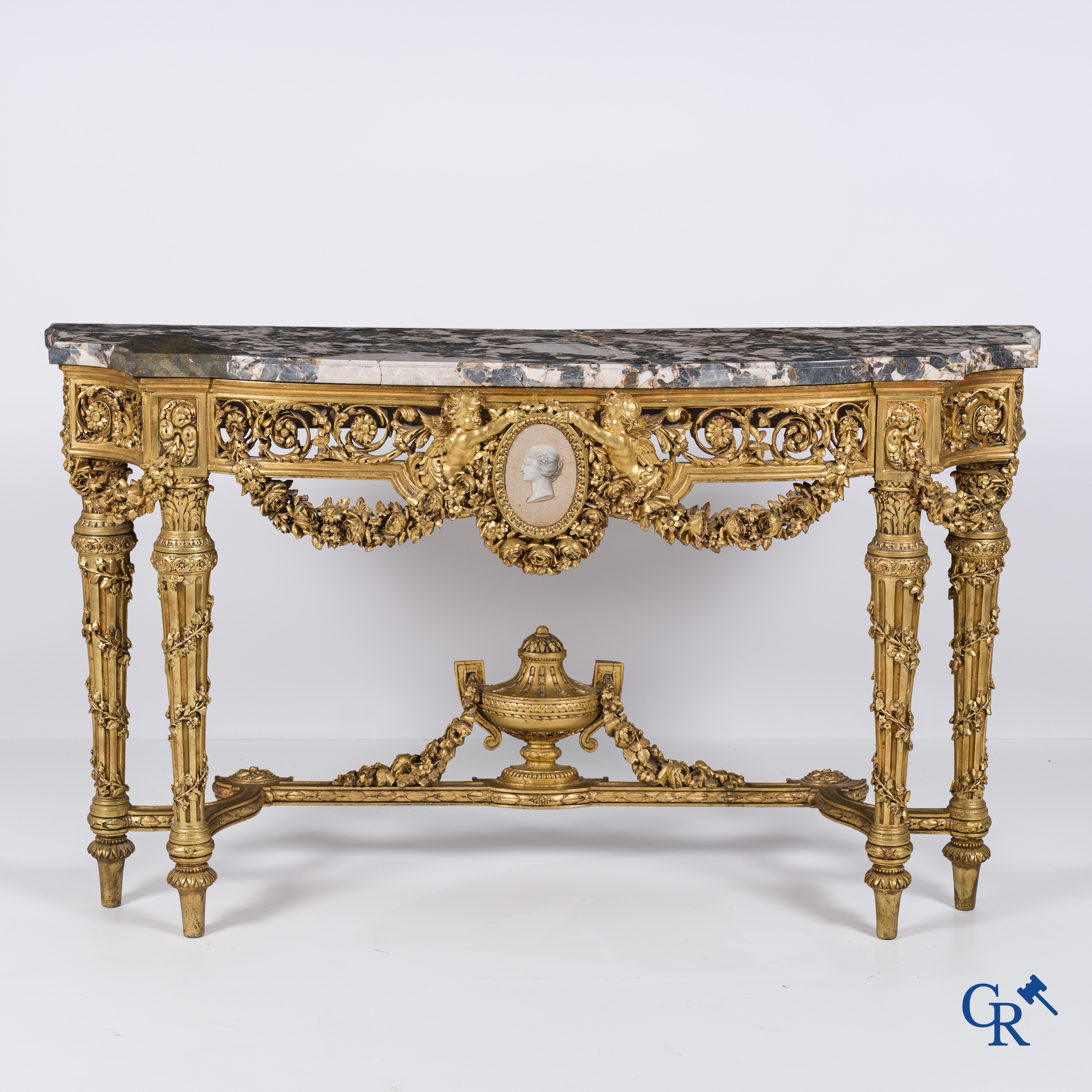 A richly carved and gilded console table in LVXI style with a grisaille painting on marble.