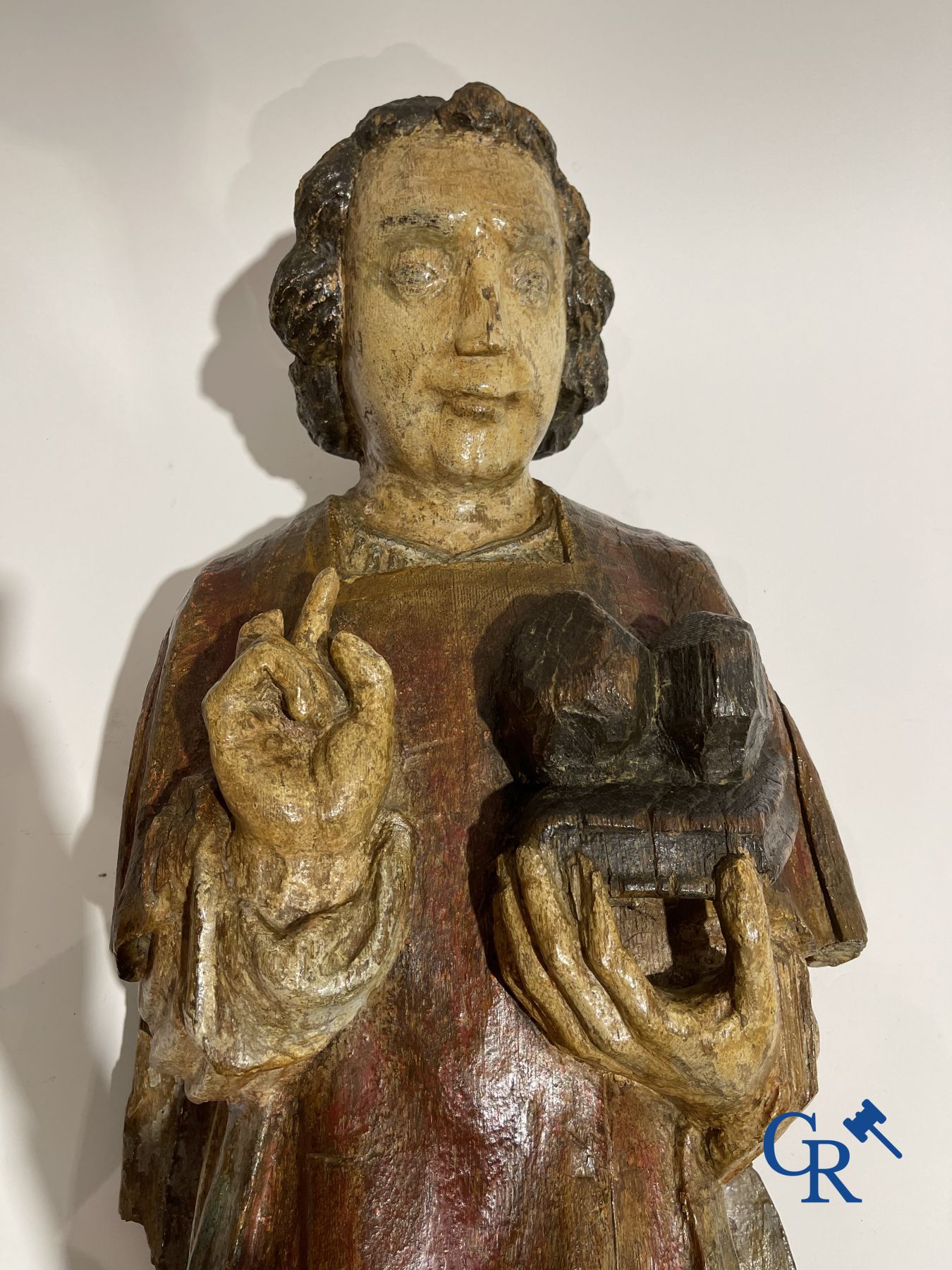 Wooden sculpture: Polychrome wood sculpture of a saint. Saint Stephen. Probably 17th century.