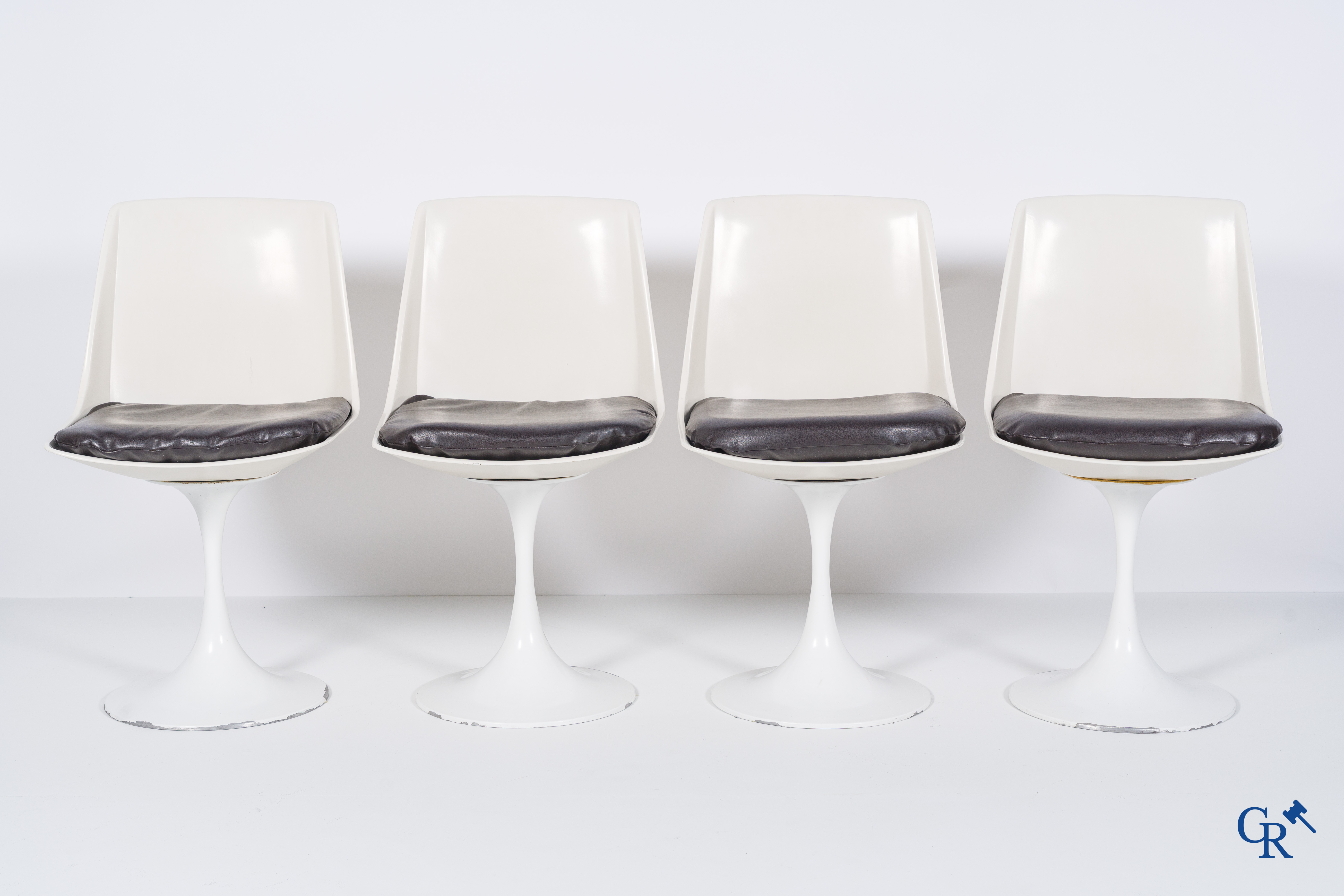 Design table with 4 chairs in the manner of Eero Saarinen, circa 1980.