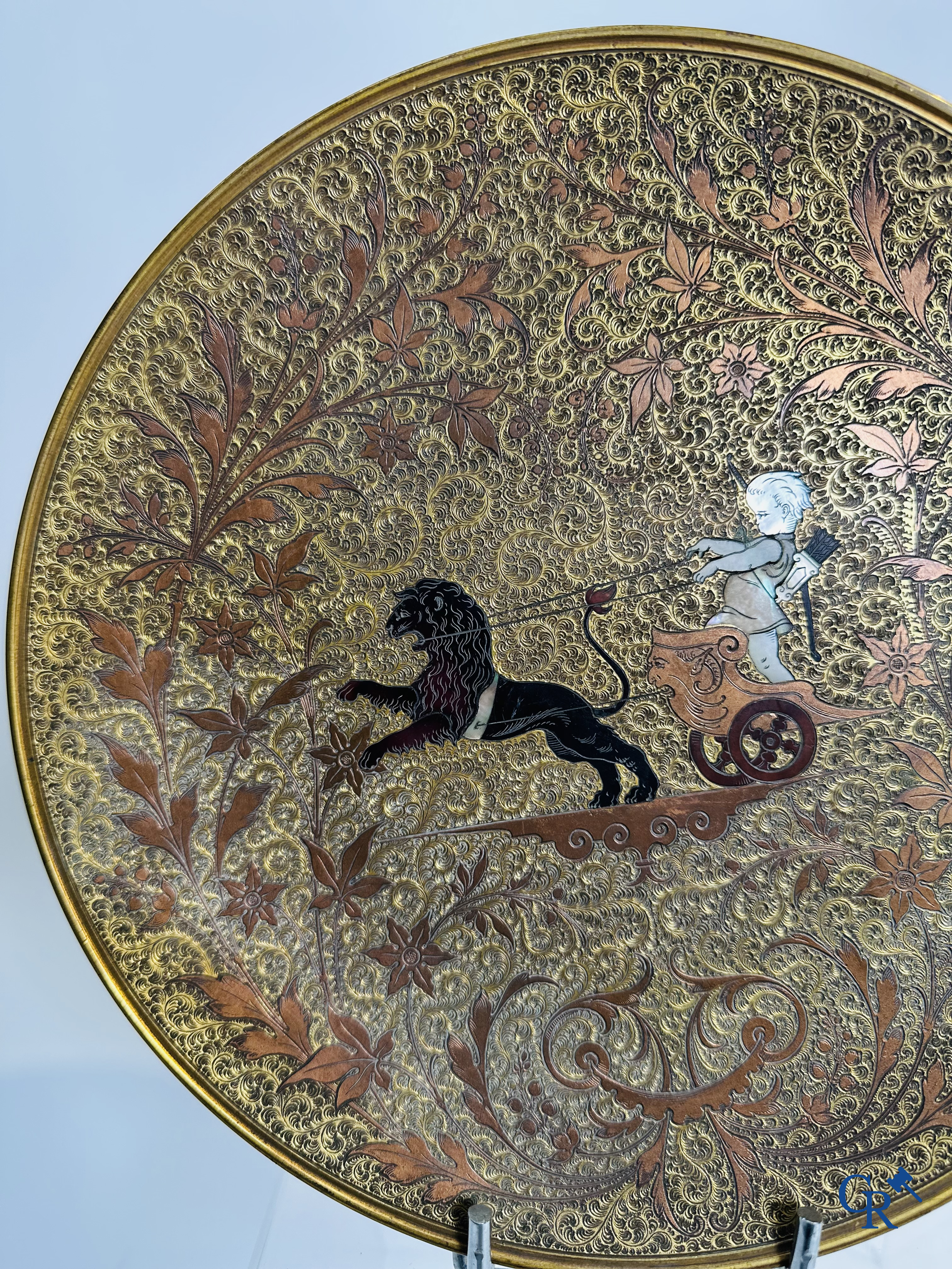 Bronze dish inlaid with mother-of-pearl and horn depicting a chariot with putti. 19th century.