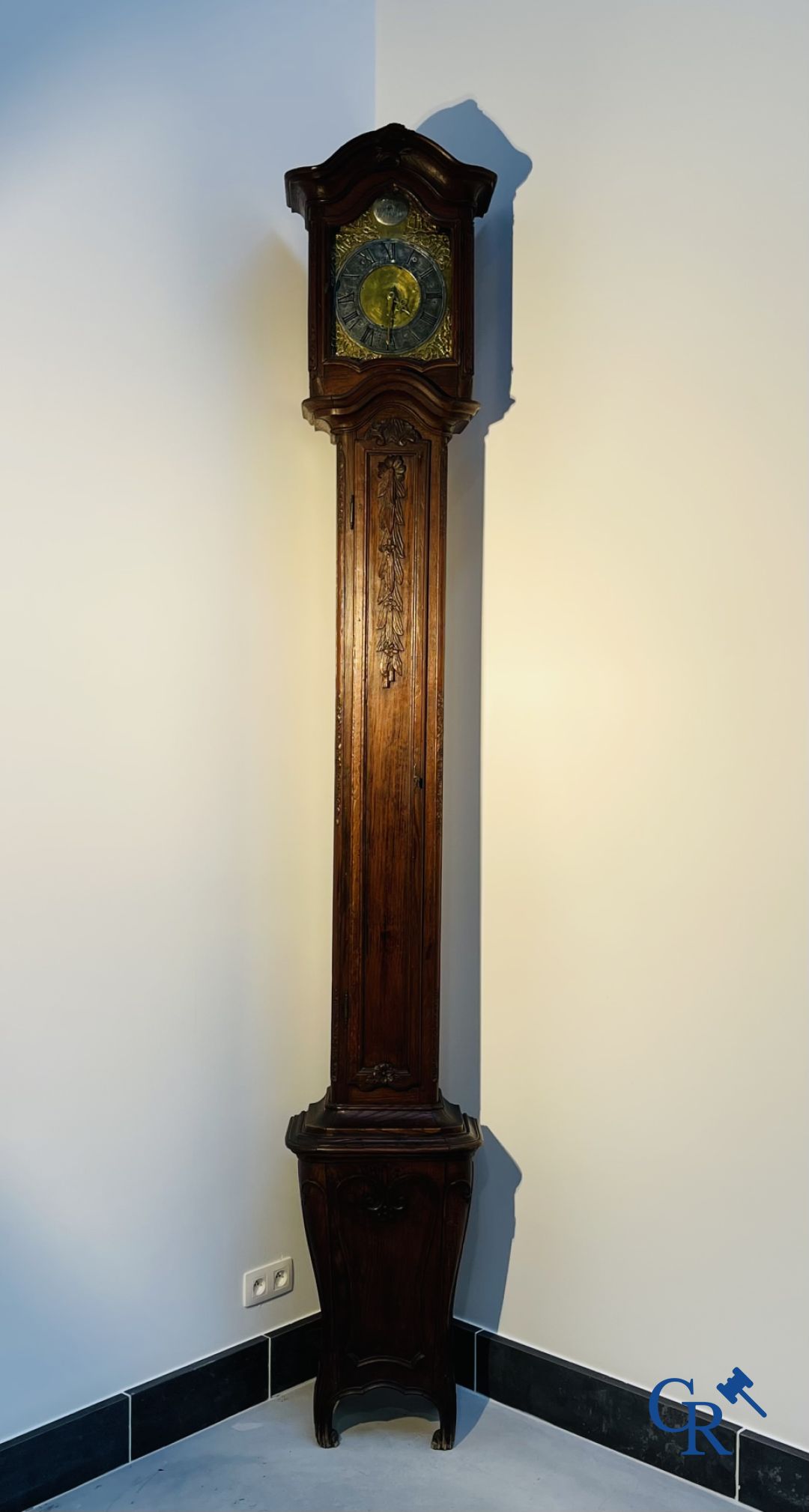 Standing clock in oak. 18th century.