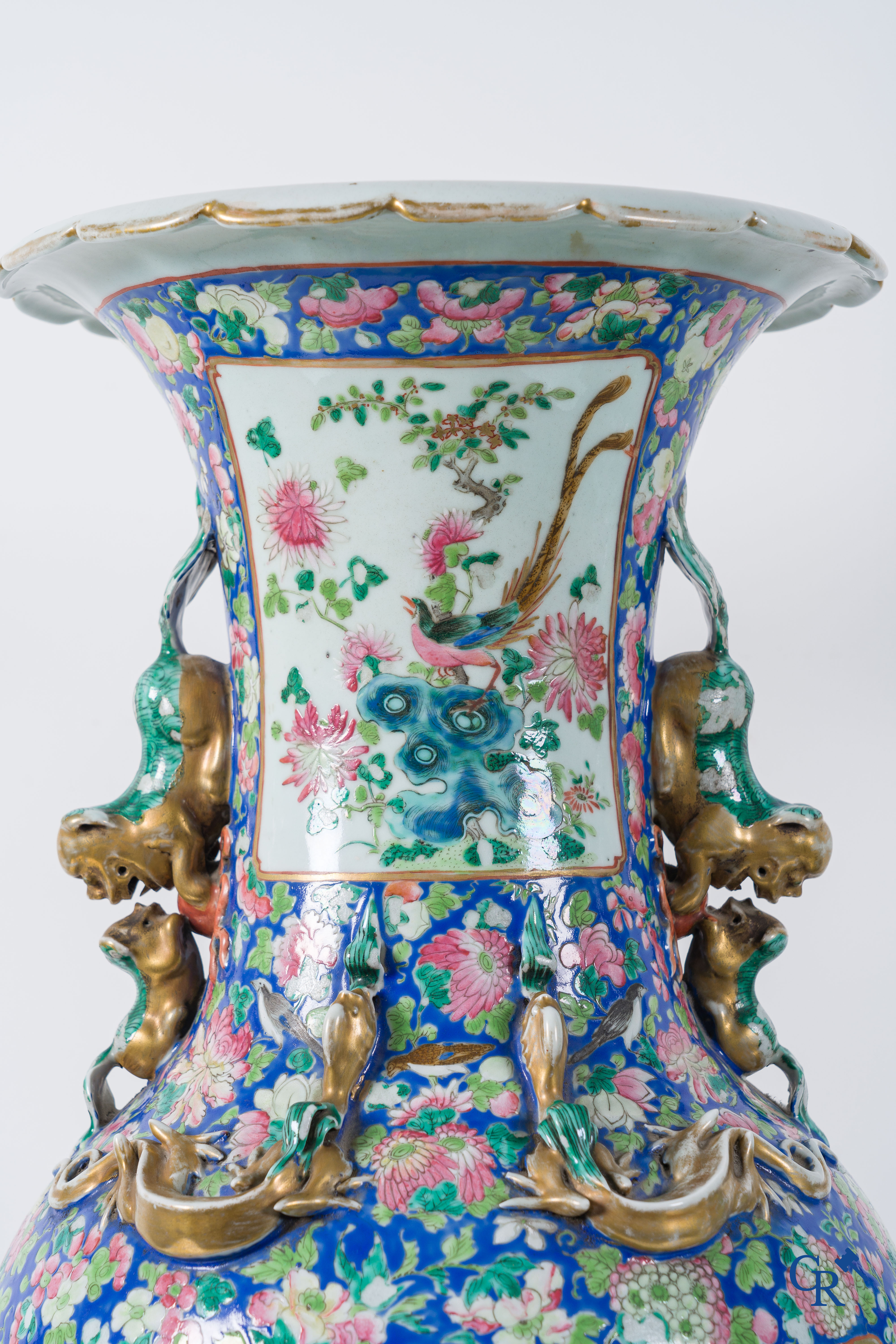 Asian Art: Chinese porcelain. A pair of imposing Chinese vases with famille rose decor. China 19th century.