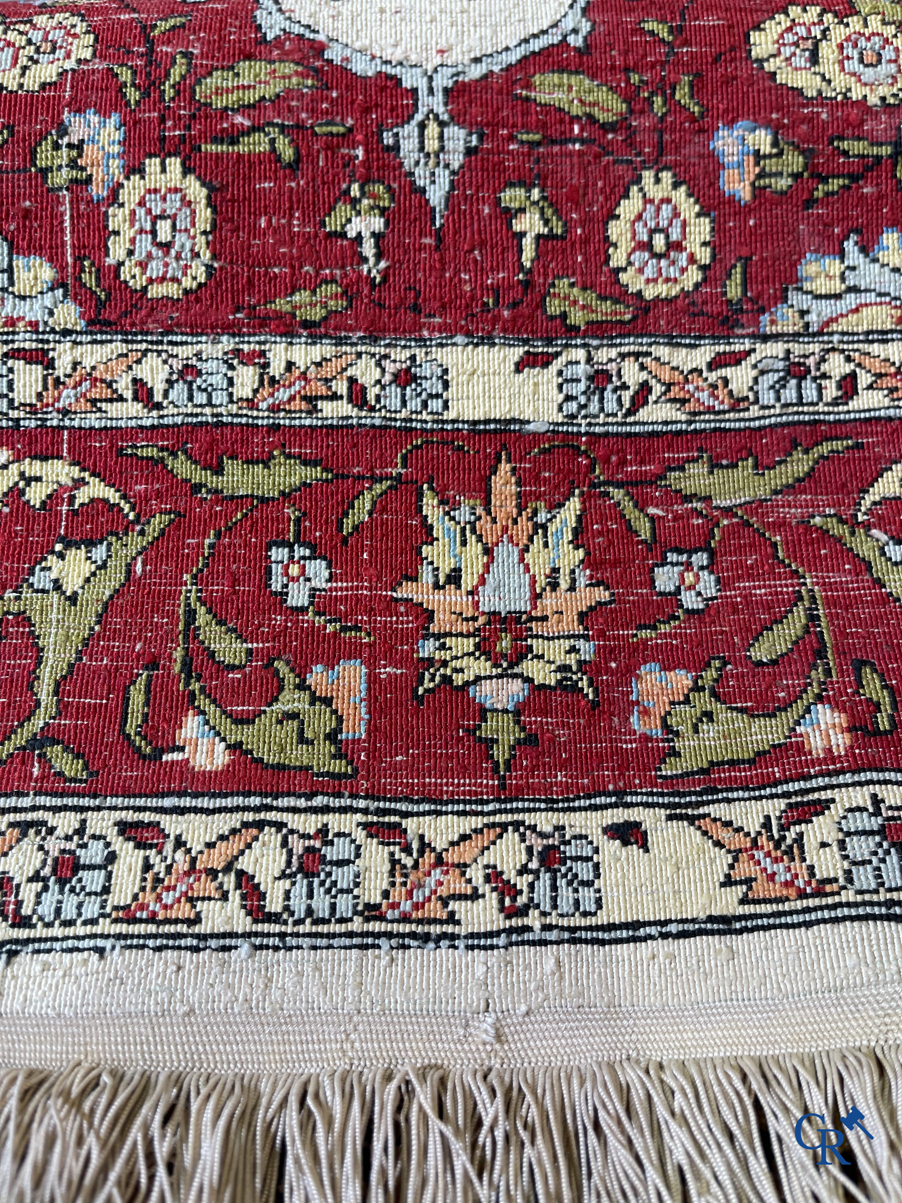 Oriental carpets, Hereke, a finely hand-knotted and signed silk carpet with a tree of life.