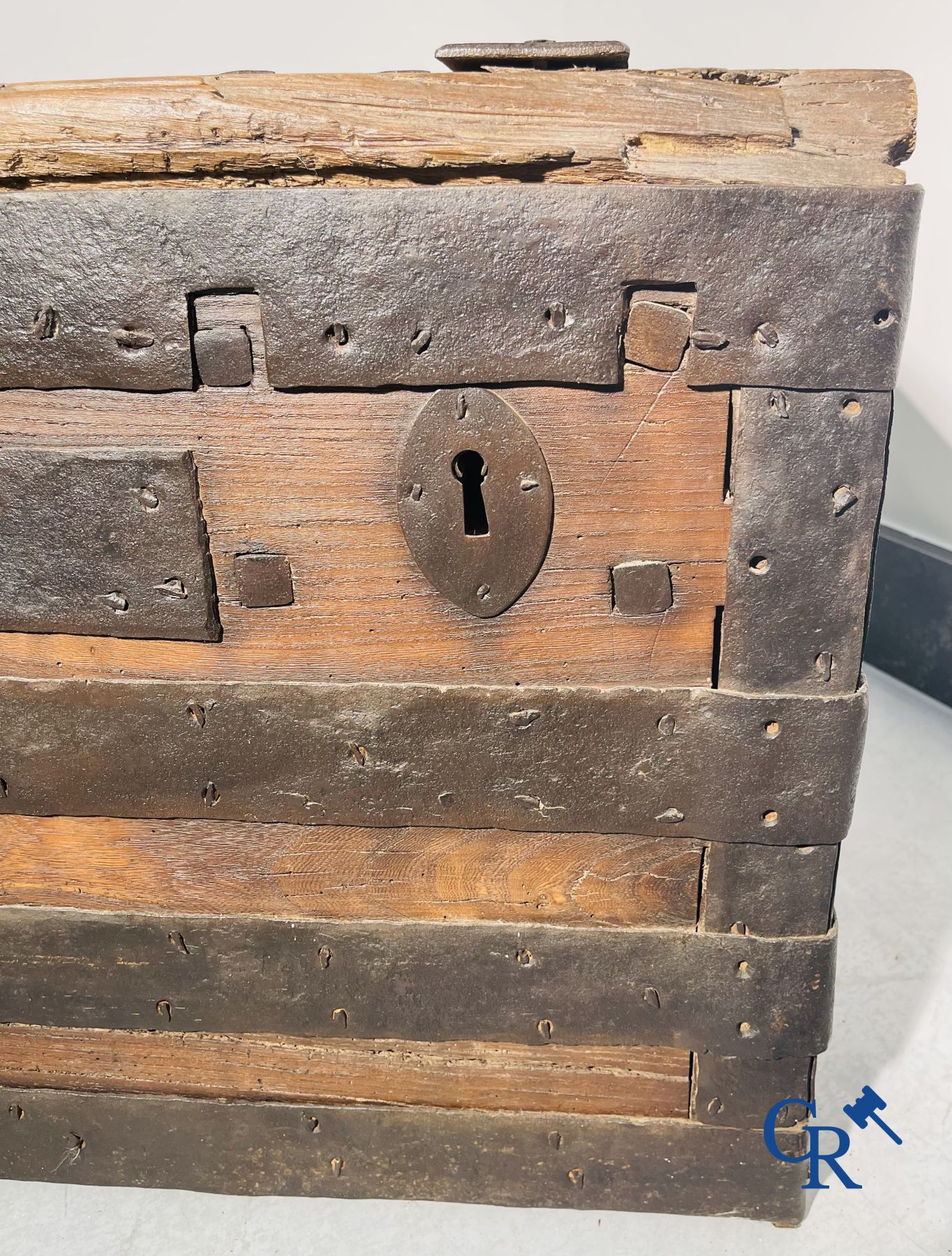 Antique wooden chest with hardware and lockwork in forging.