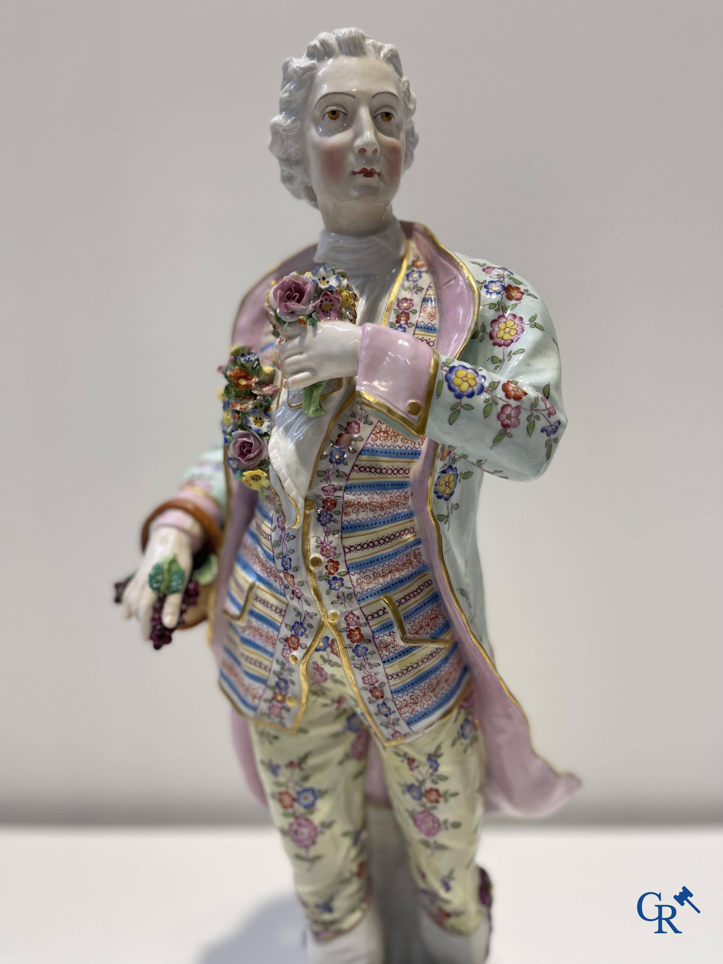 Exceptionally large pair of romantic statues in coloured and gilded porcelain in the manner of Meissen.