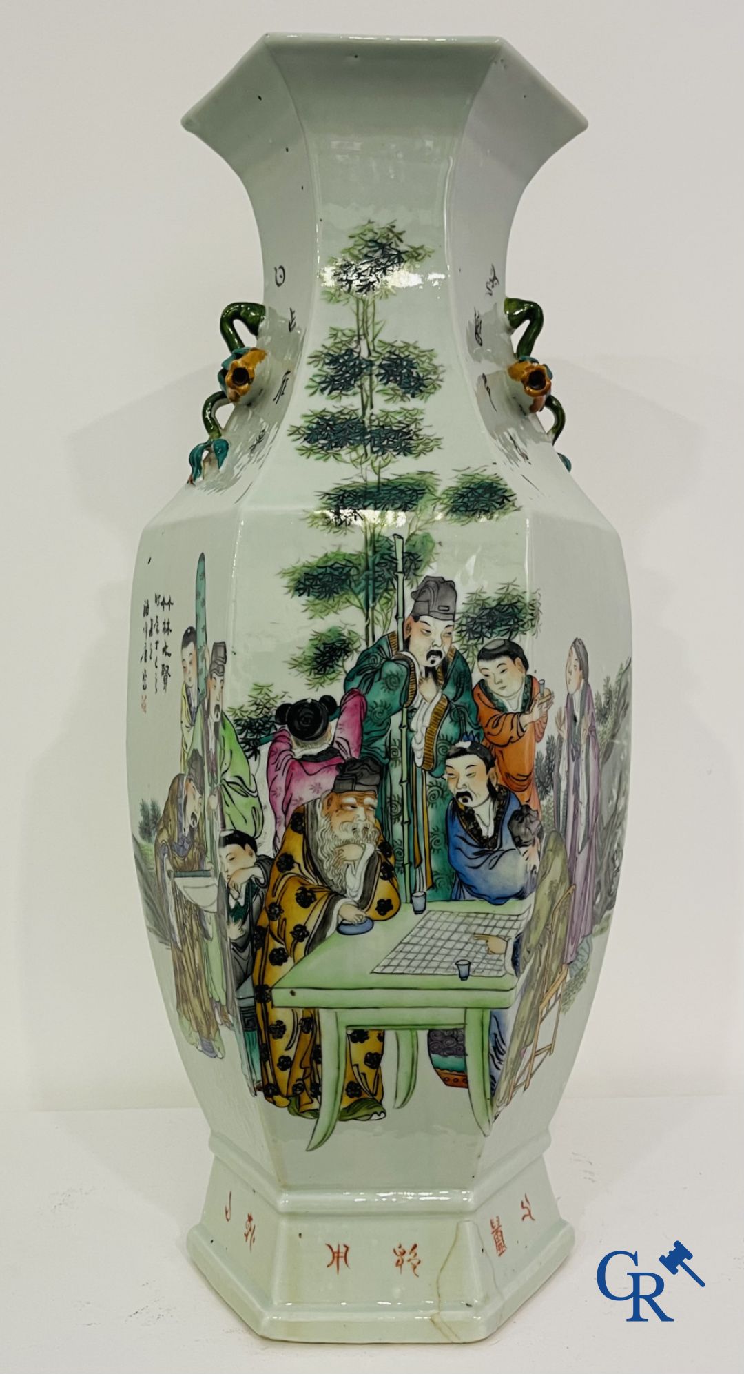 Asian Art: Chinese porcelain. A hexagonal Chinese Famille rose vase with sages and scholars. 19/20th century.