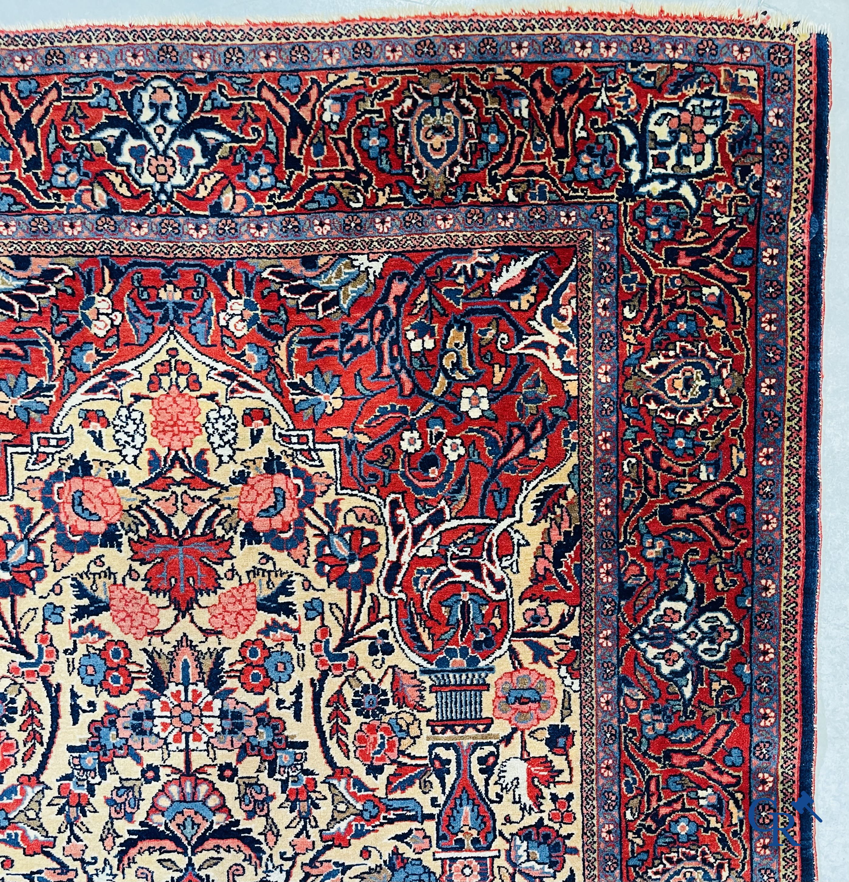 Oriental carpets: Iran. 2 antique hand-knotted Persian carpets with floral decor.