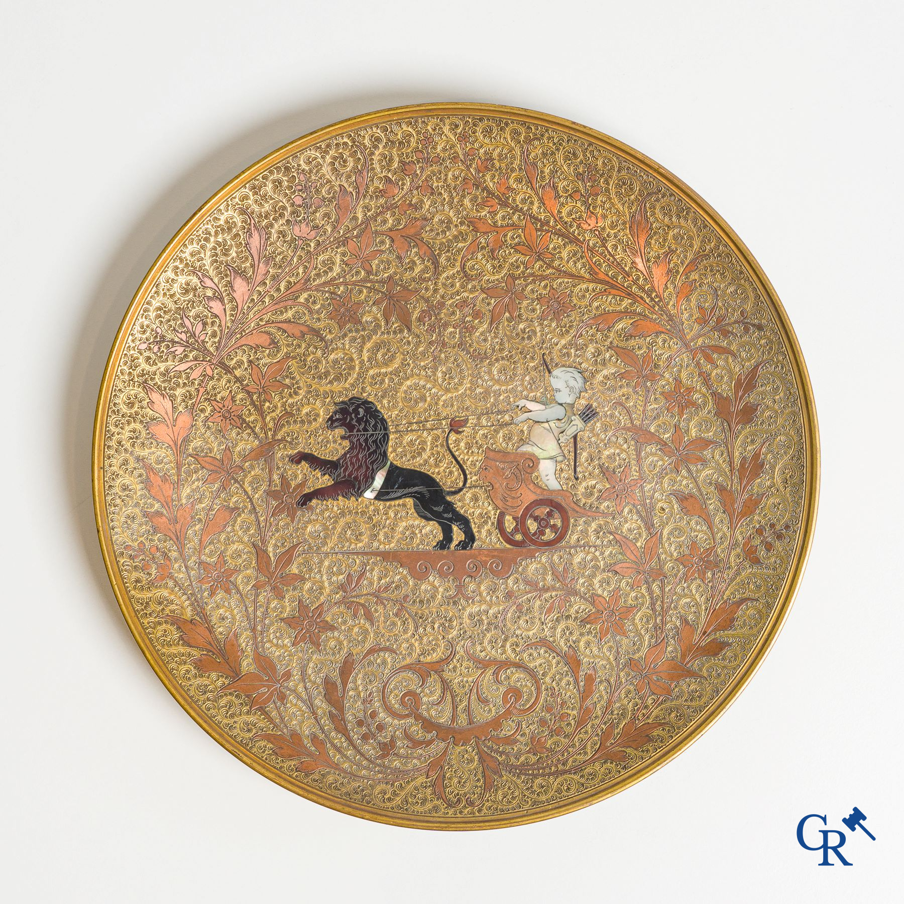 Bronze dish inlaid with mother-of-pearl and horn depicting a chariot with putti. 19th century.