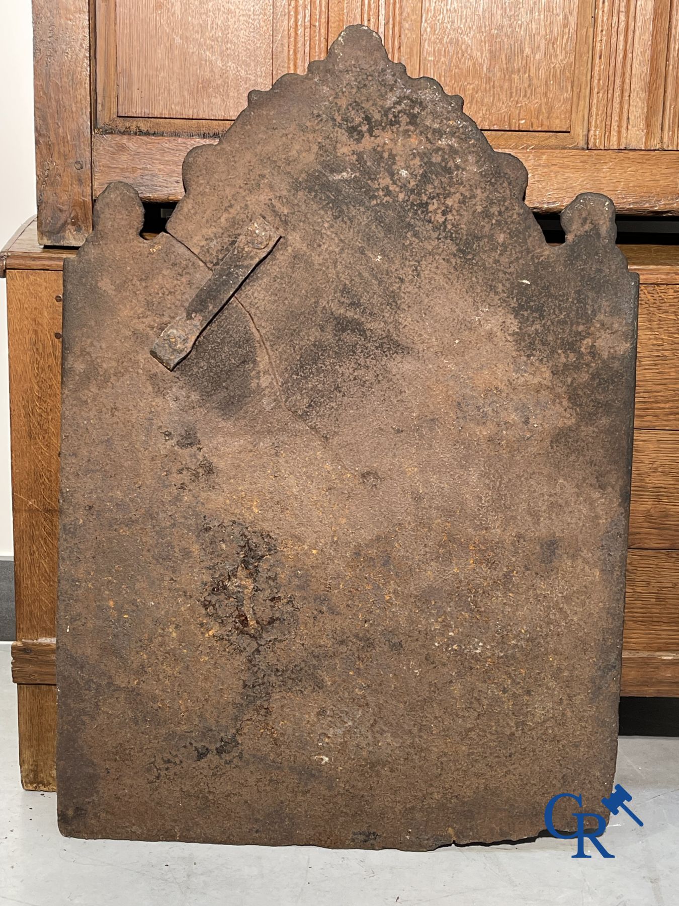 2 oak chests and an antique cast iron fireplace plate.