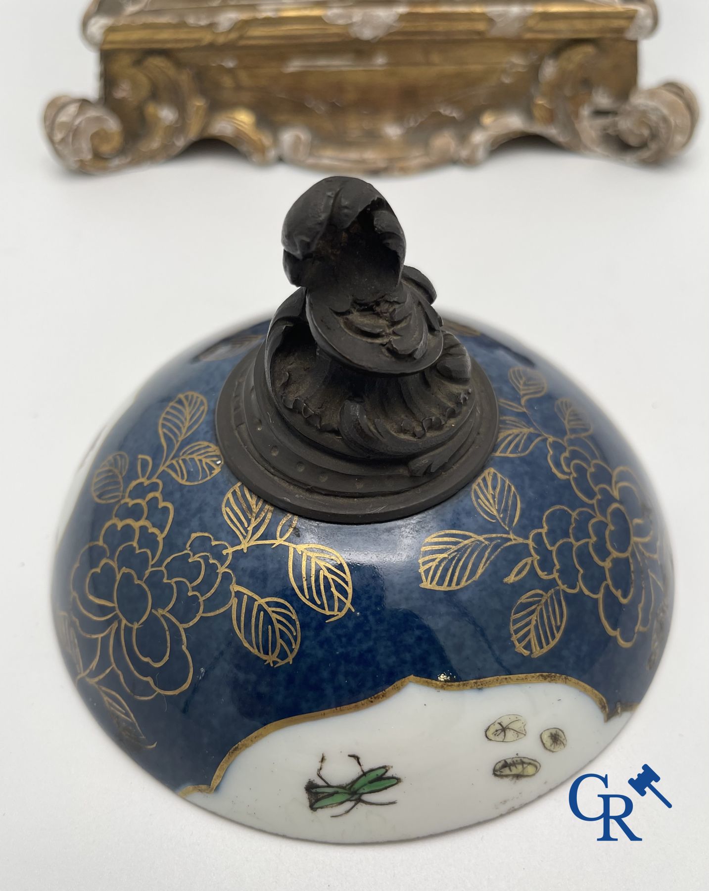 A porcelain table fountain with bronze fittings.