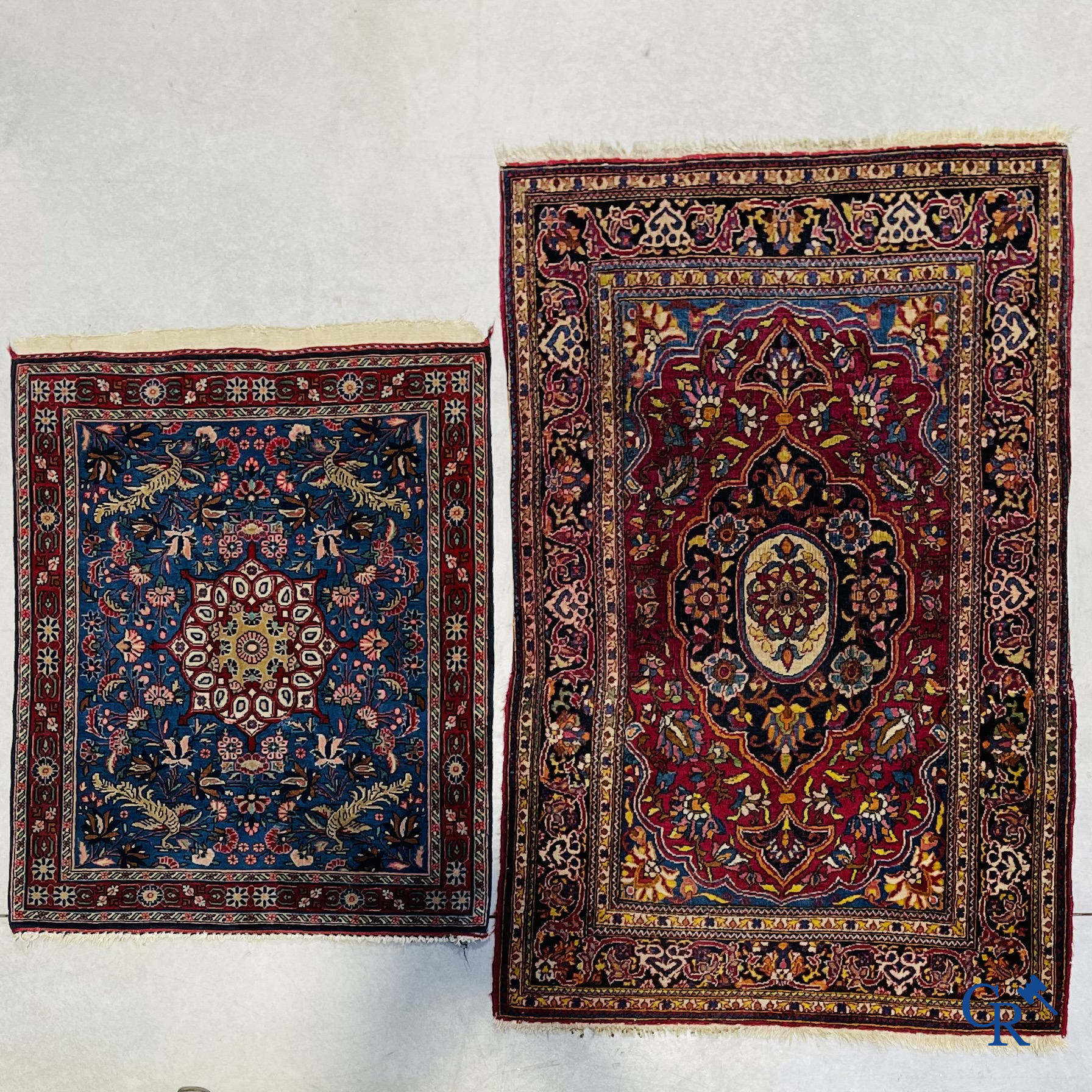 Persian carpets: A lot of 2 finely knotted Oriental carpets. Floral decor and floral decor with birds of paradise.