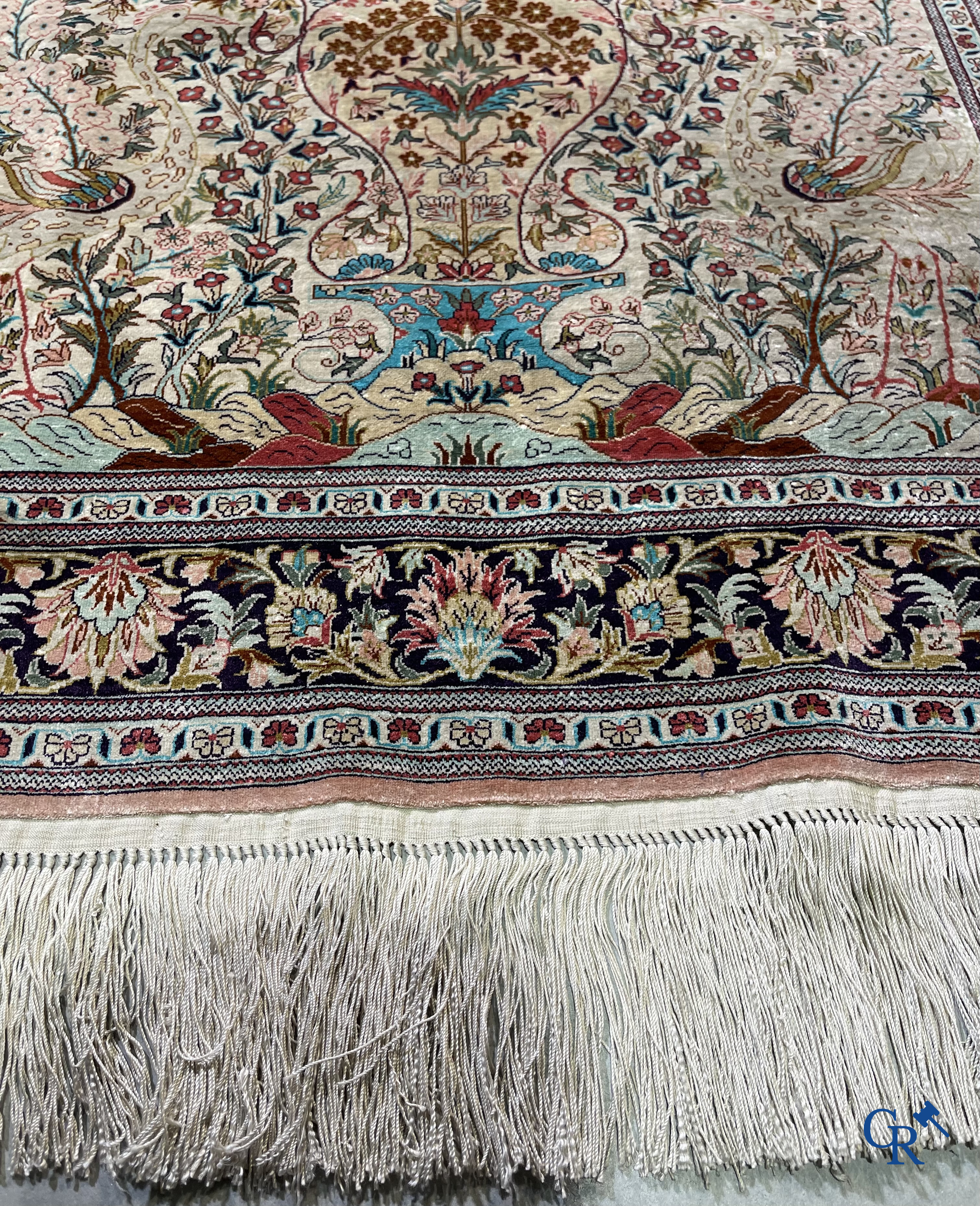 Oriental rugs: A finely hand-knotted silk Persian rug with a flower vase and birds in a floral decor.