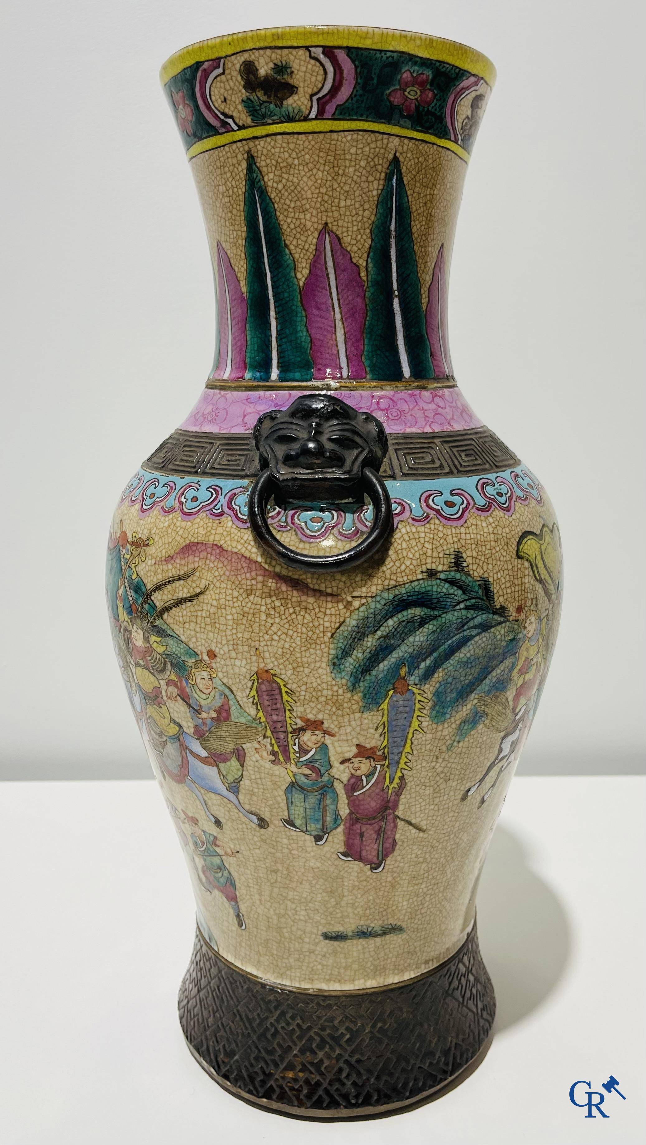 Asian art: A Chinese Nanking famille rose crackle vase with warrior decor. 19th century.