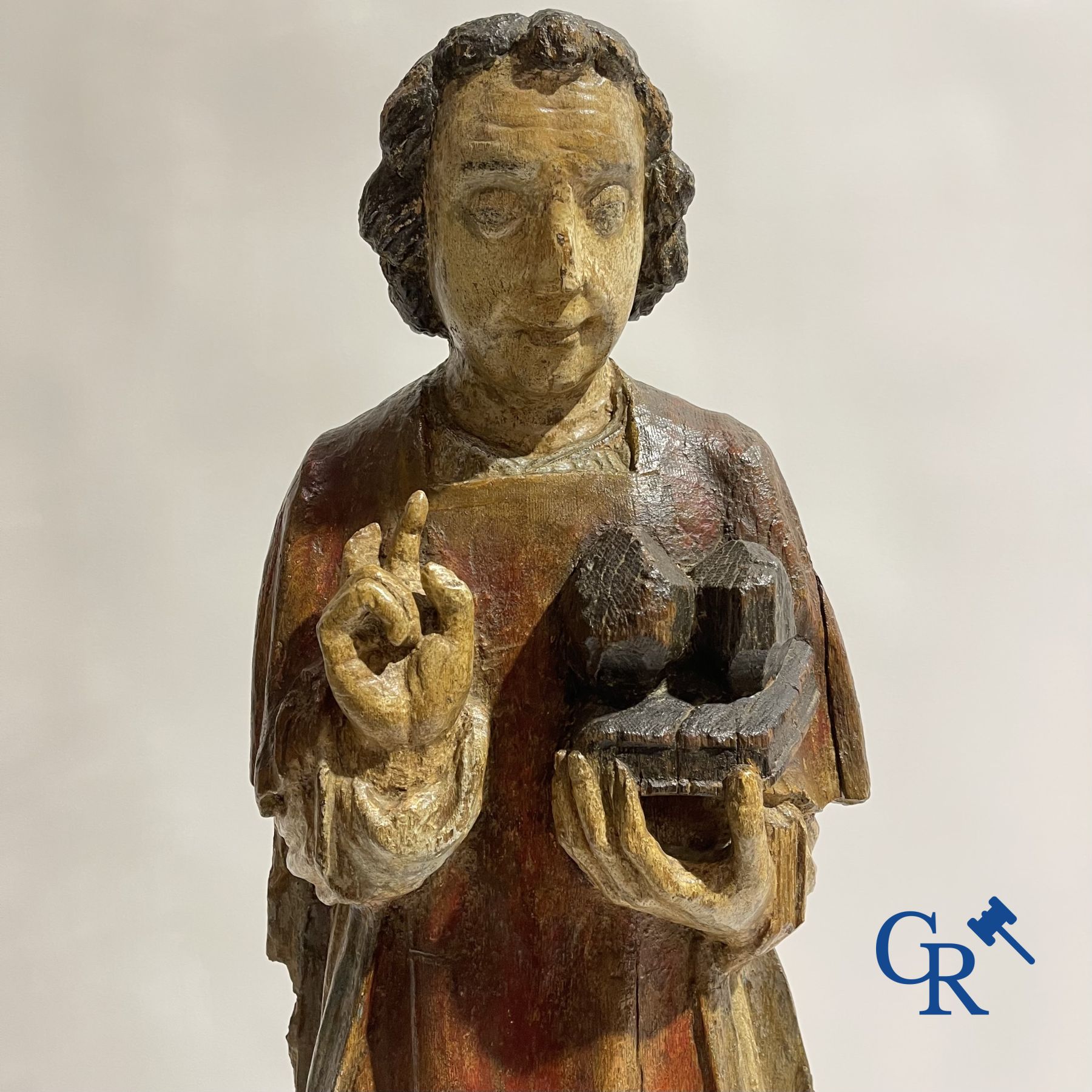 Wooden sculpture: Polychrome wood sculpture of a saint. Saint Stephen. Probably 17th century.