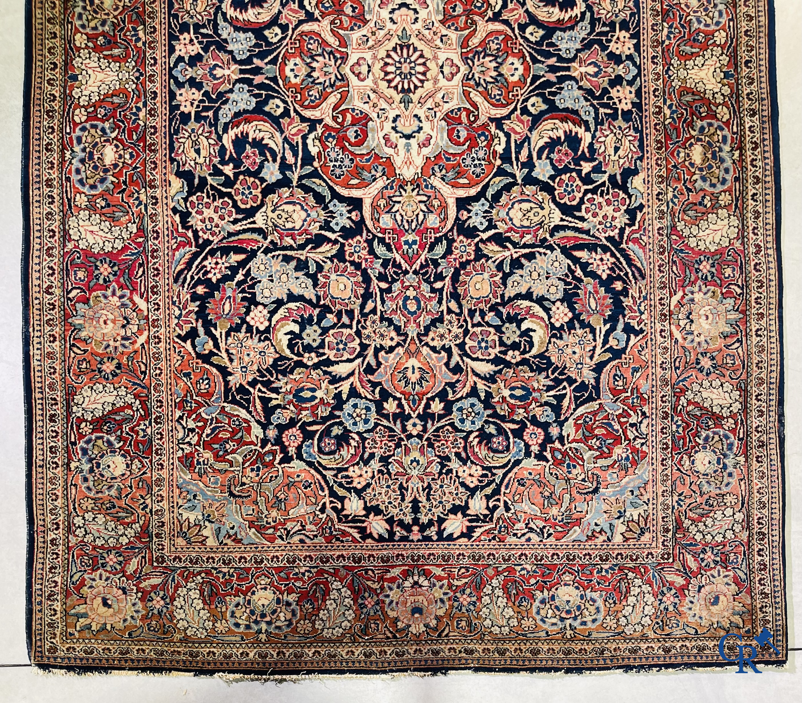 Oriental carpets: Iran. 2 antique hand-knotted Persian carpets with floral decor.