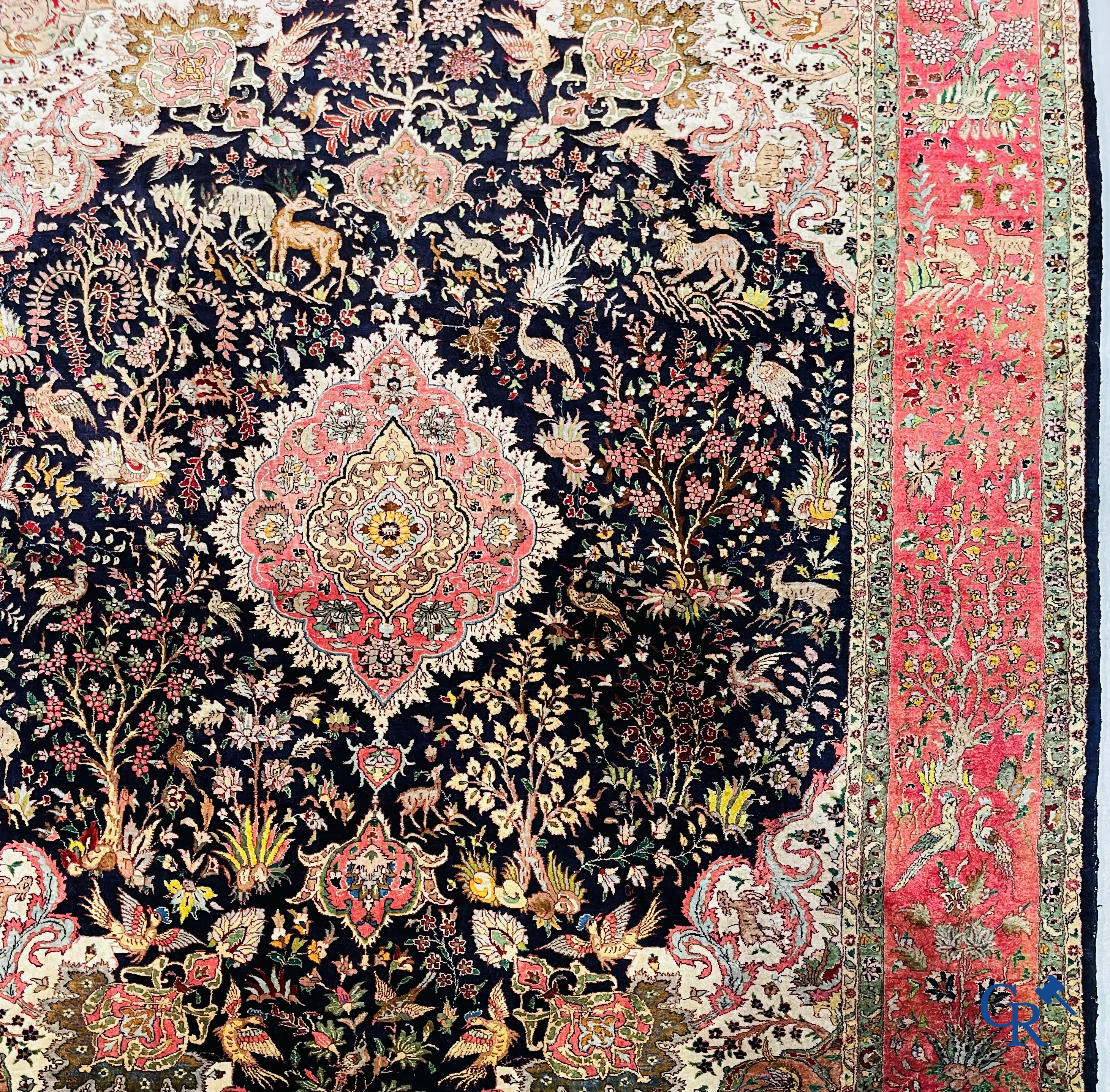 Oriental carpets: Tabriz, a finely hand-knotted silk carpet with forest animals and birds in a floral decor.