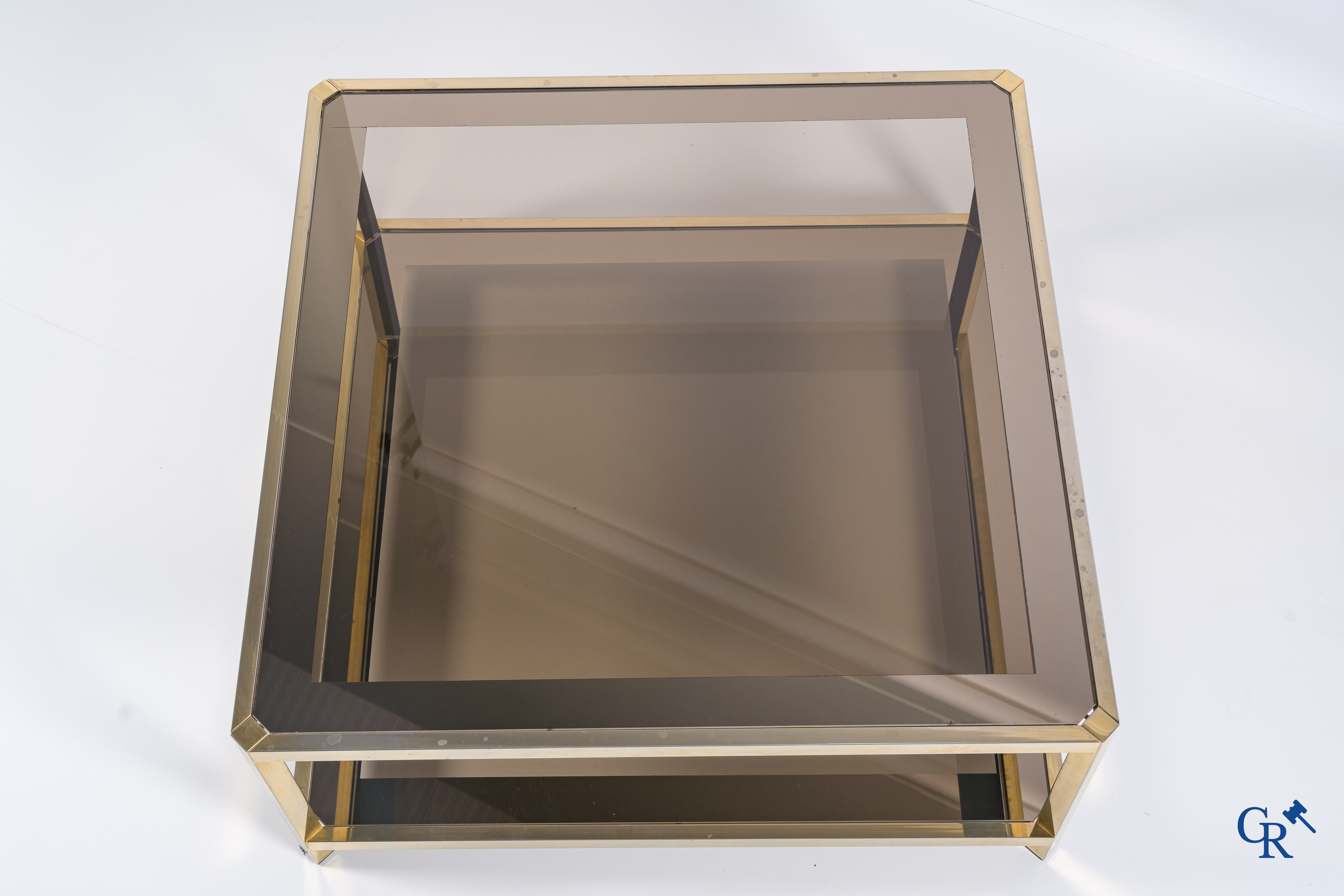 Design: Belgochrom, a large coffee table in gold-plated brass and glass, circa 1980.