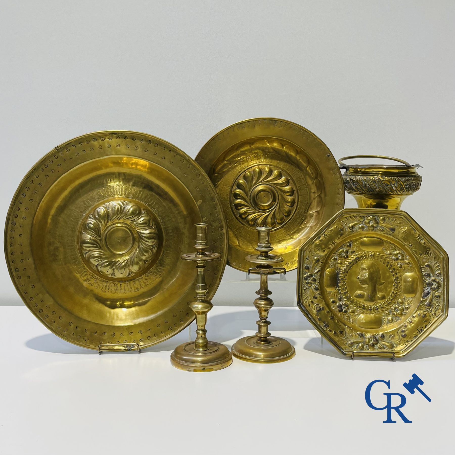 A lot of 2 large baptismal dishes, a portrait dish, 2 candlesticks and a holy water bucket. 16th-17th century.