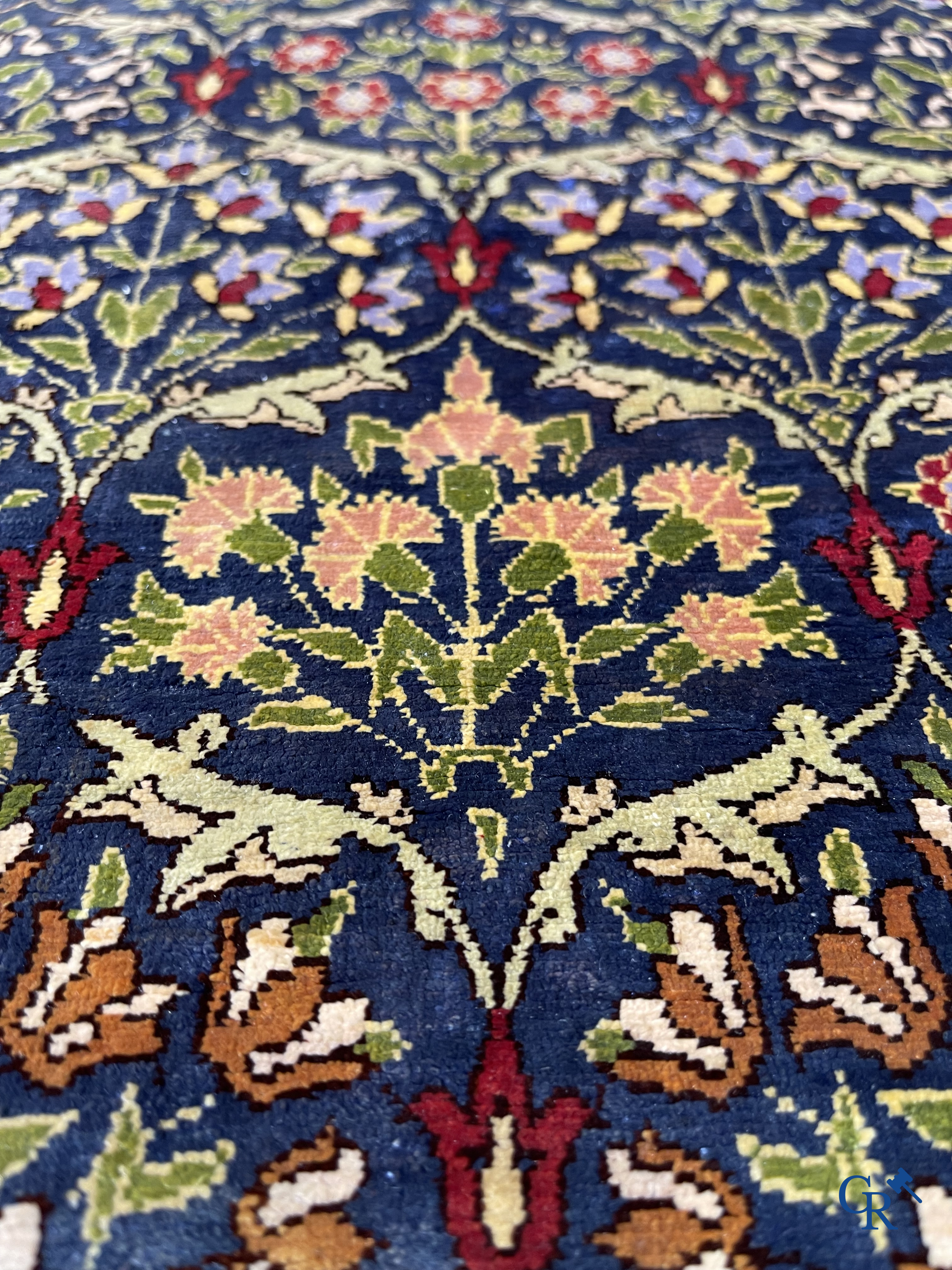 Oriental carpets, a finely hand-knotted silk carpet with floral decor.